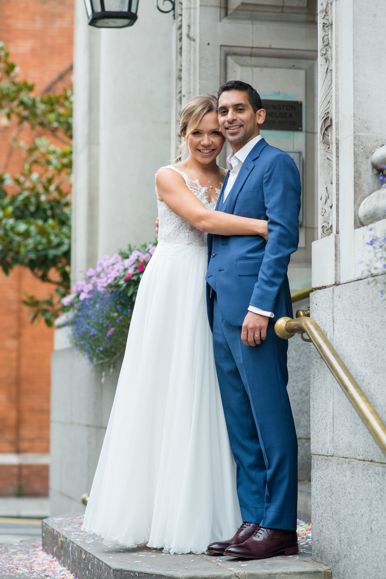 A bride and groom on the steps of Number Sixteen